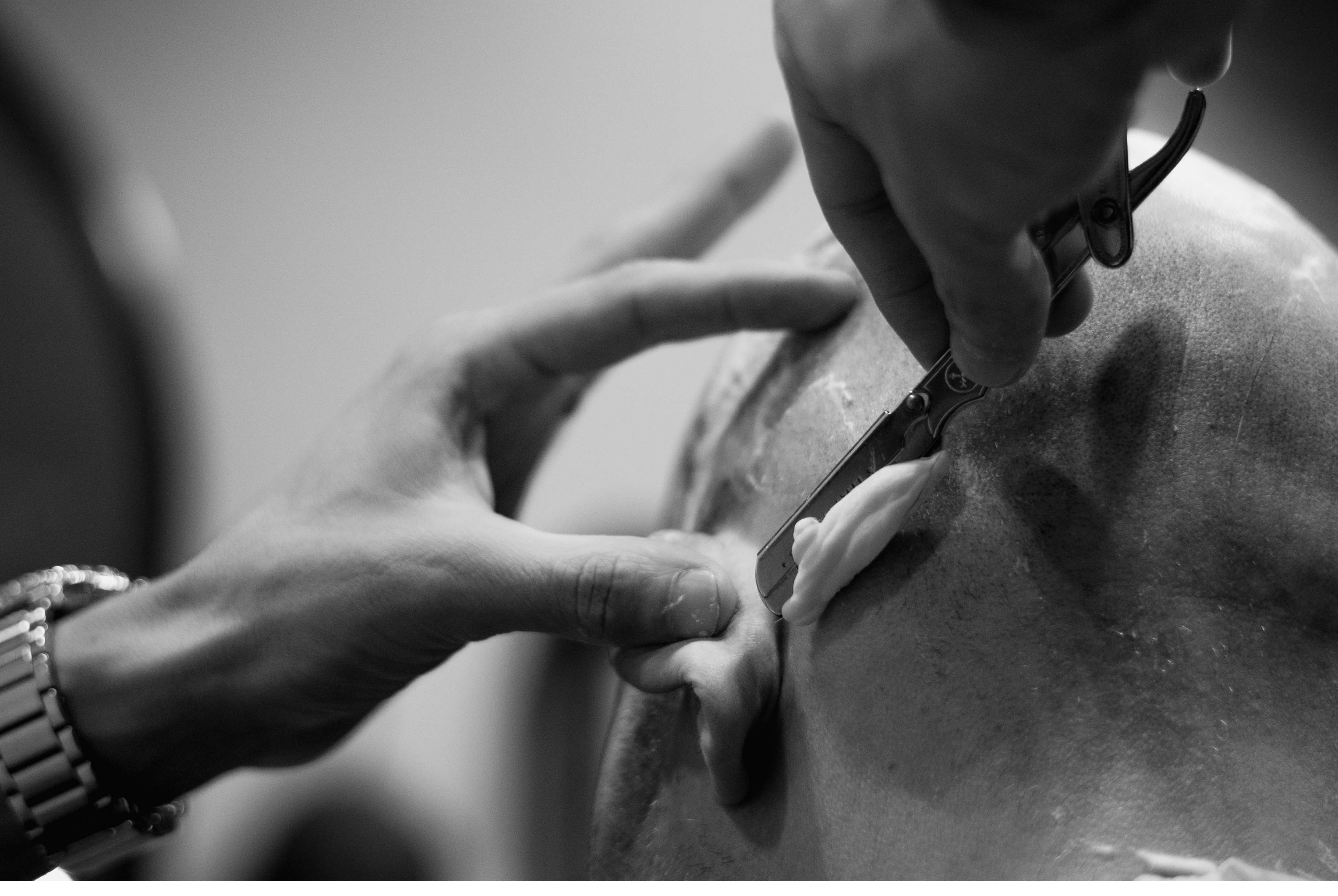 Detailed photograph of a straight razor shave on the scalp